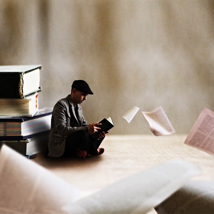 Reading — surreal photography by Achraf Baznani