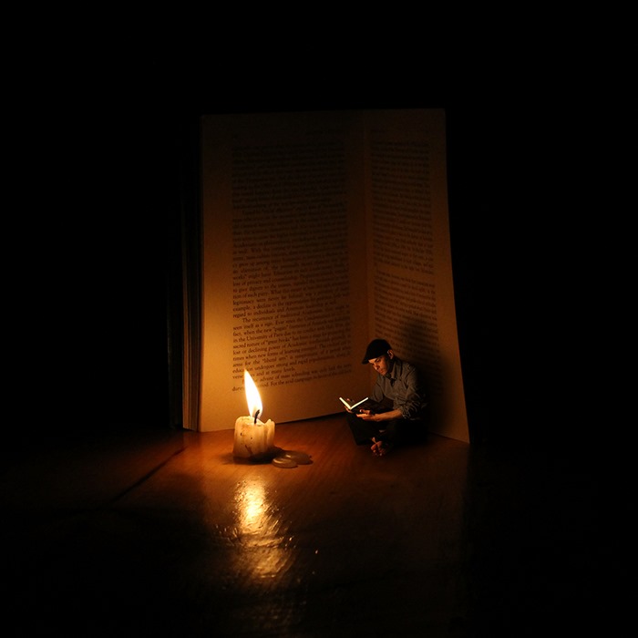 Book is candle — surreal photography by Achraf Baznani