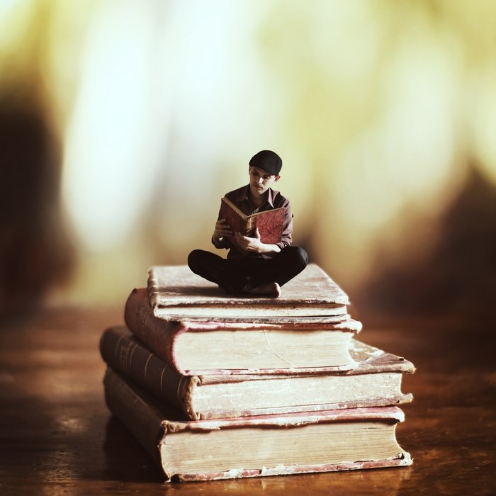 The reader — surreal photography by Achraf Baznani